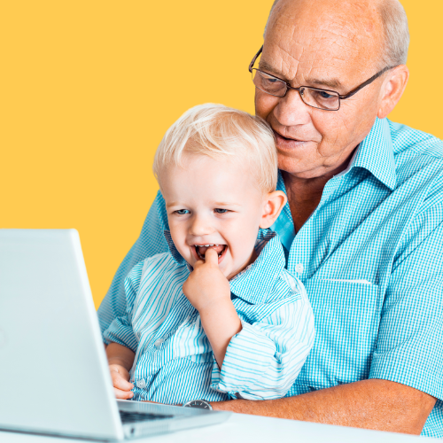 senior and child on laptop